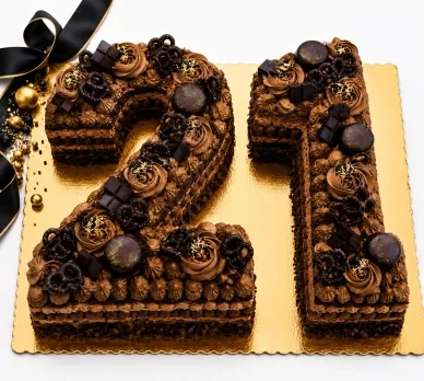 Chocolate number 21 cake with chocolate decorations and gold accents